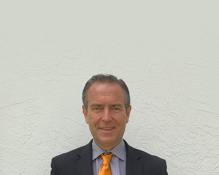 Russell D. Bernstein with a white wall in the background